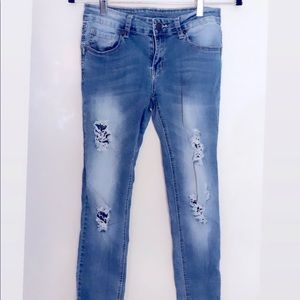 Light blue ripped jeans